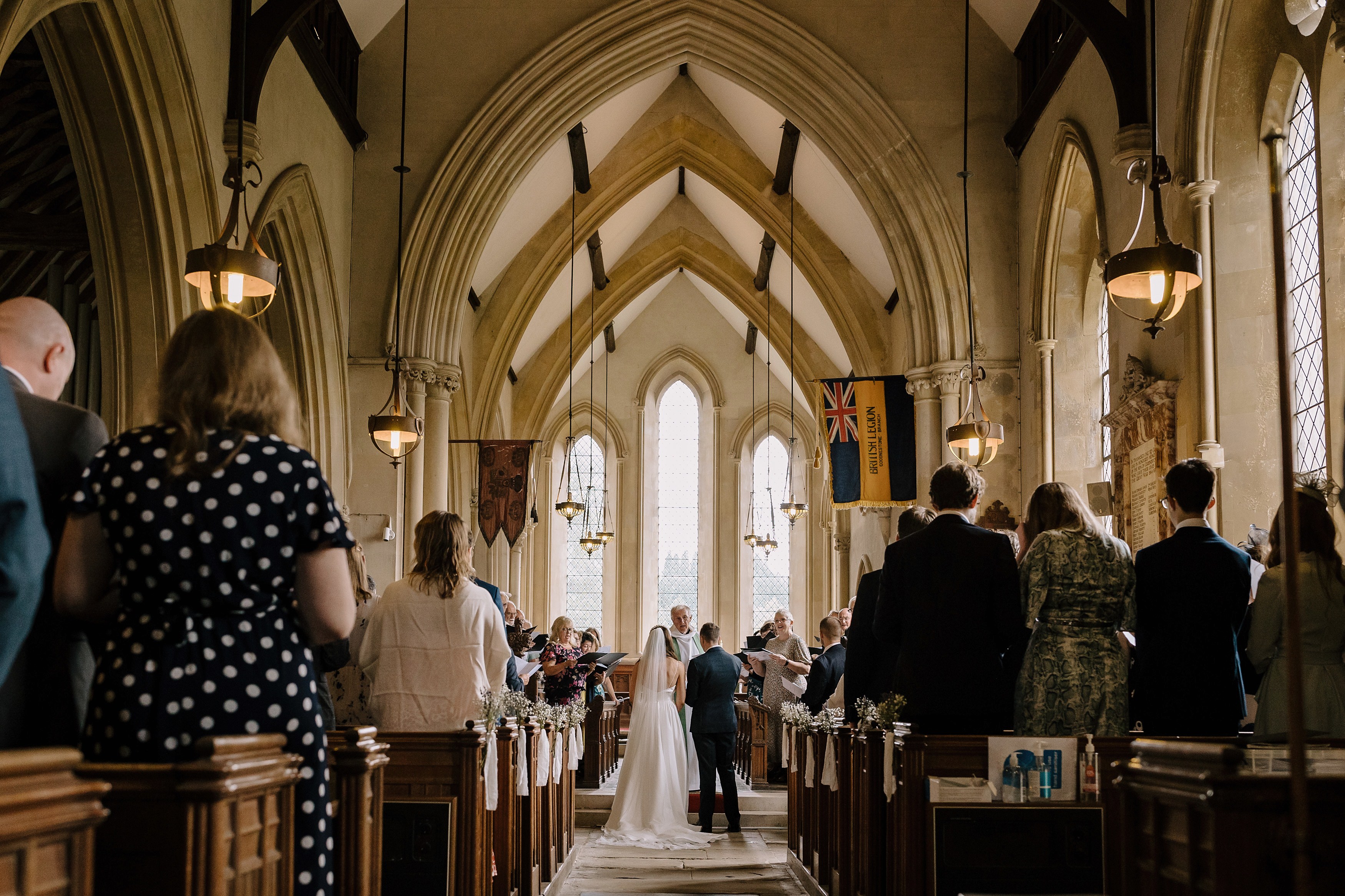 A view from the back of the church showing a bride and groom getting married