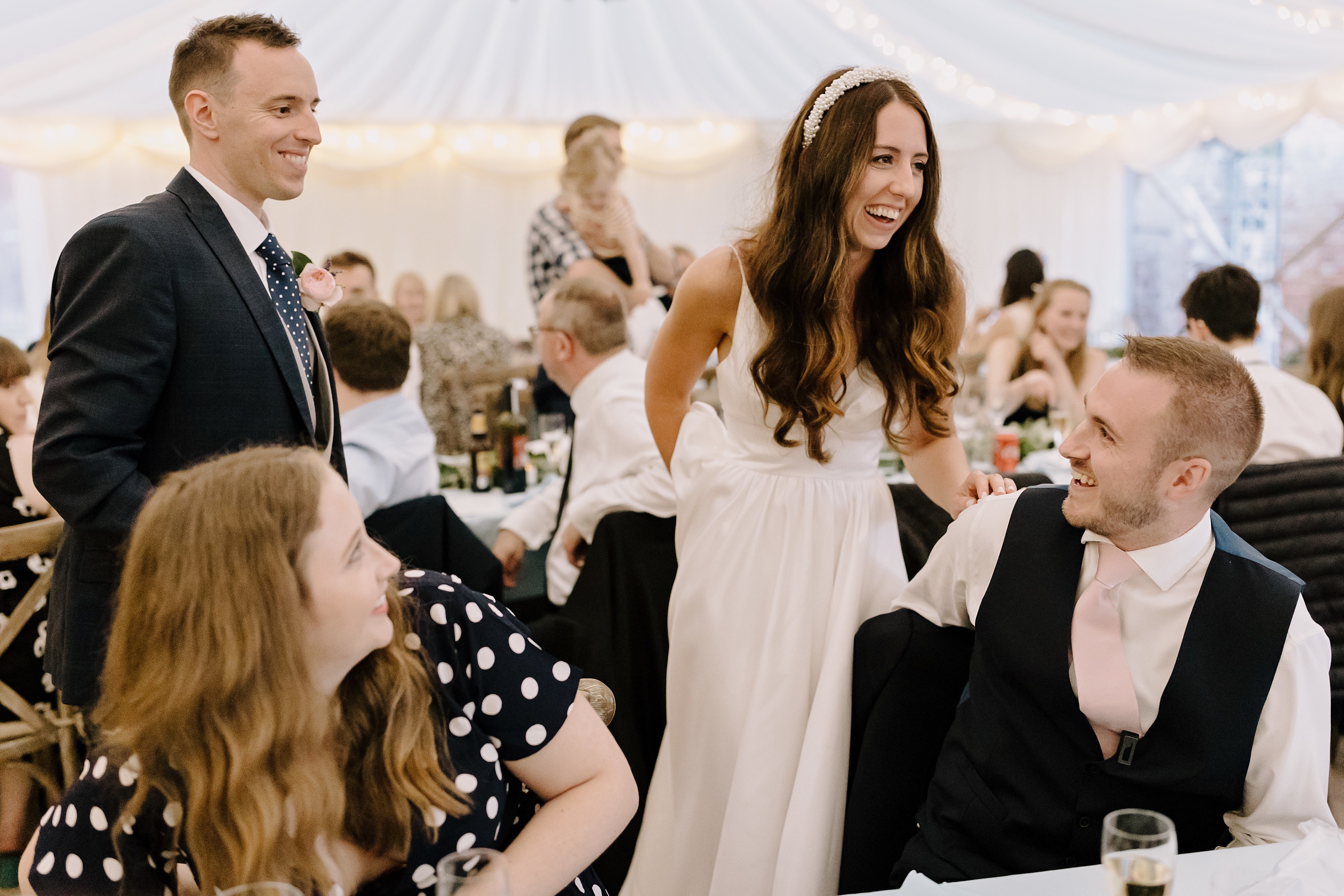 The bride and groom greeting their guests during the wedding breakfast