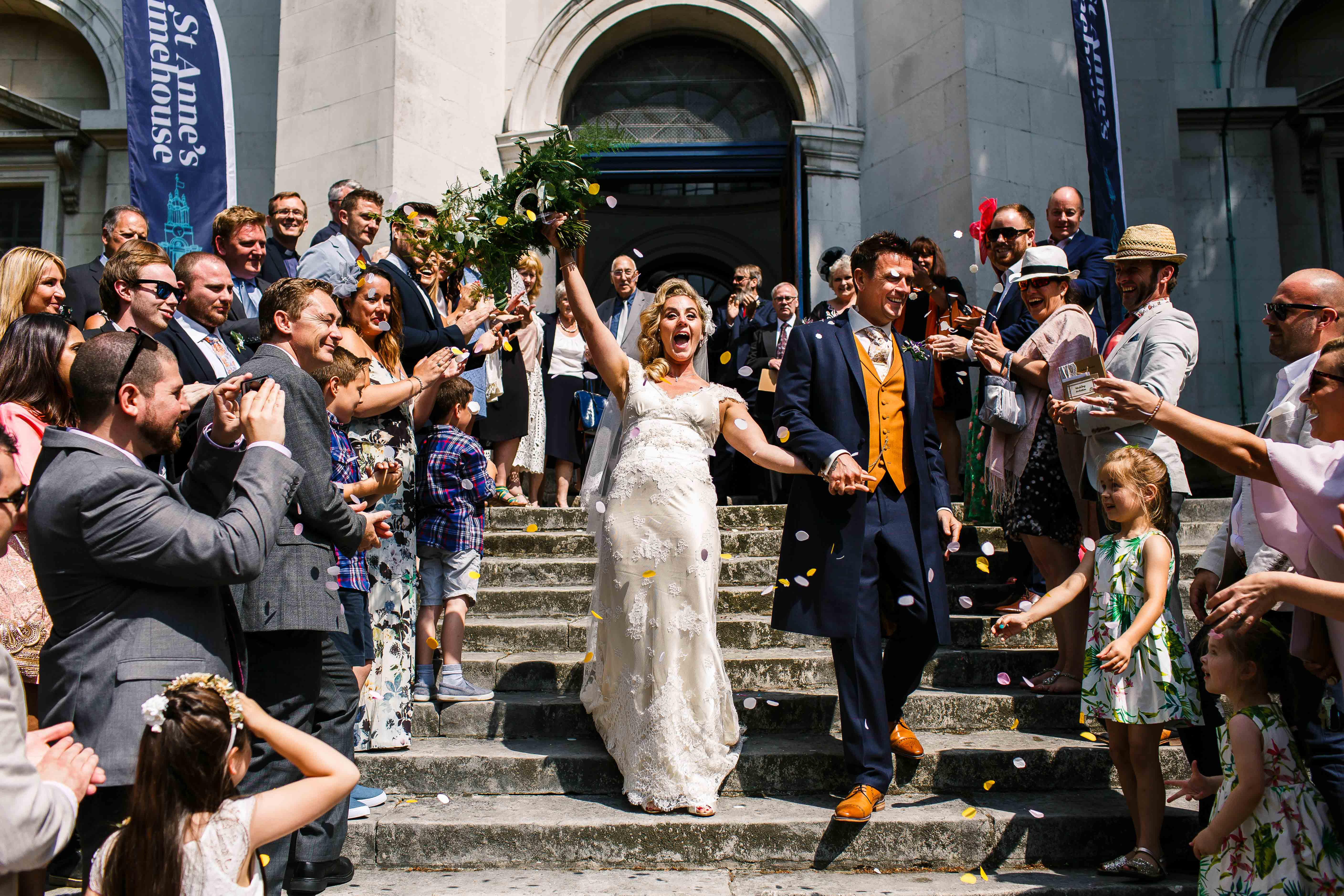 Exited couple walk down St Anne's Limehouse