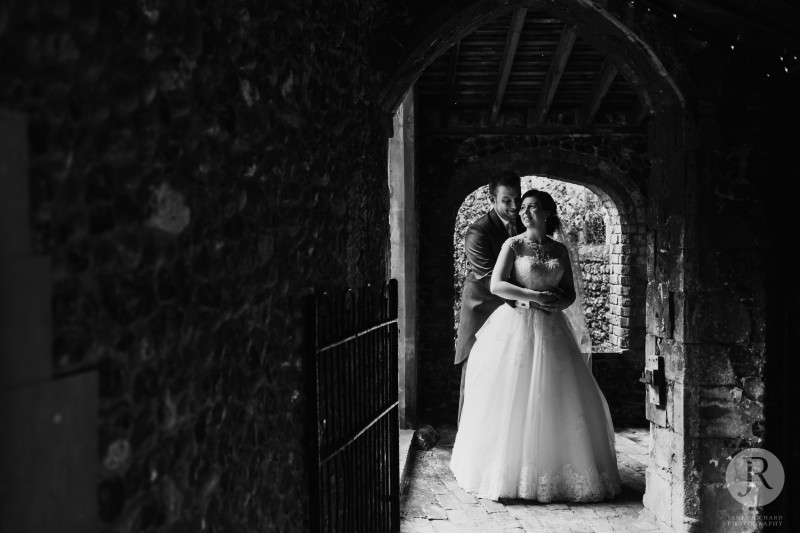 Married couple smiling at each other during their Salmestone grange wedding