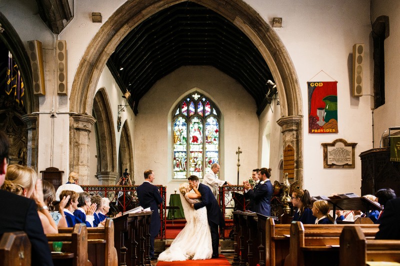 Couple kiss once they are pronounced married