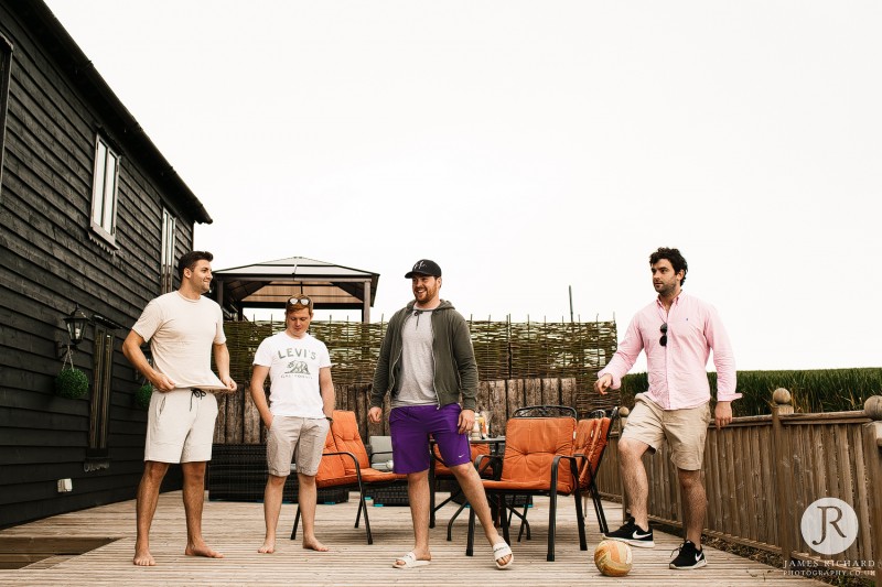 Groomsmen playing football