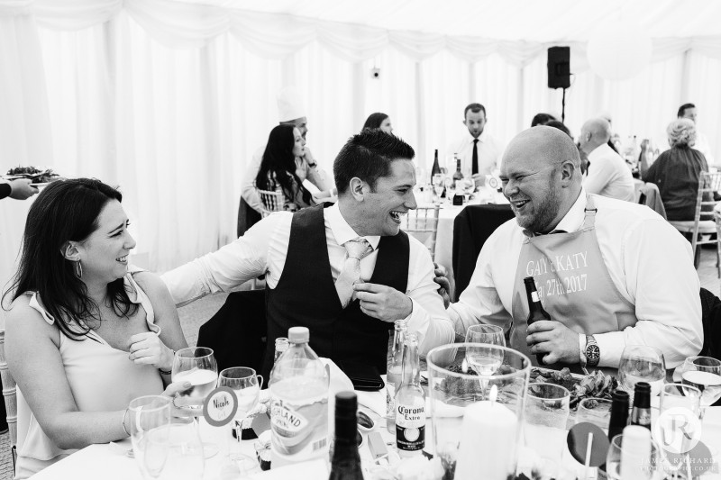 wedding guests laughing together