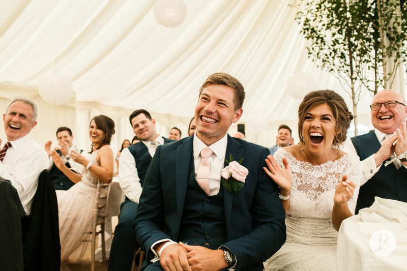 Bride and groom laughing together 