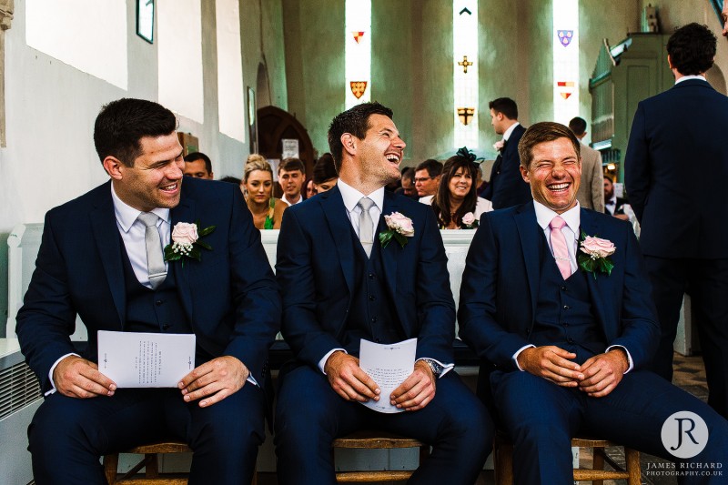 groom and his brothers laughing.