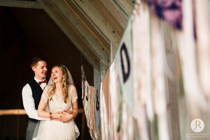 beautiful couple laughing at Wilderness Weddings Kent
