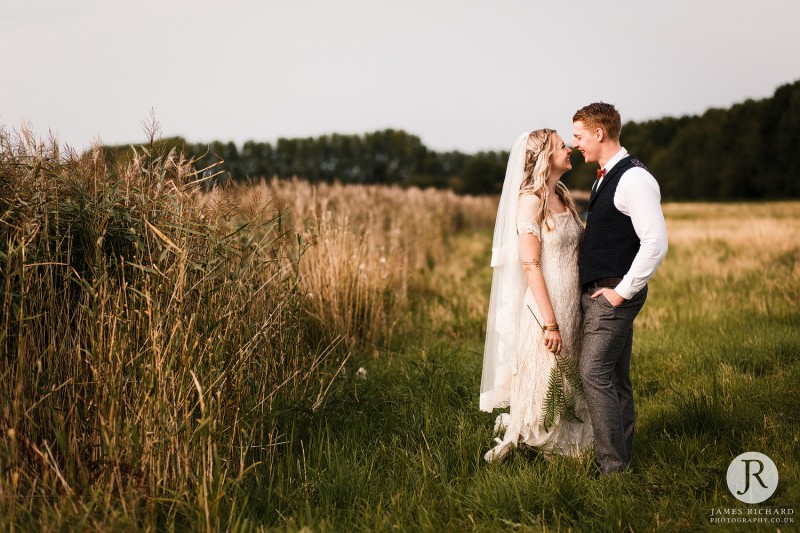 Couple in field looking at each other