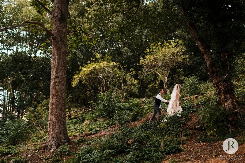 Boho couple walking up a hill