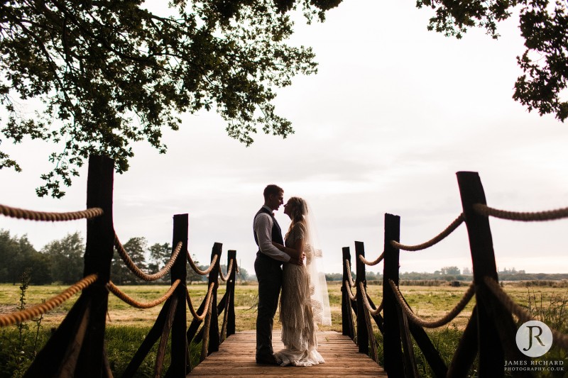 Silhouette of couple on a bridge 