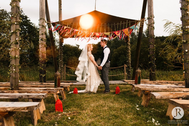 Couple laughing together in ceremony location