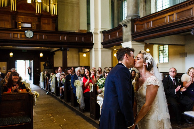 Alternative Couples kiss during their ceremony
