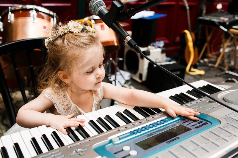 Little girl playing the piano