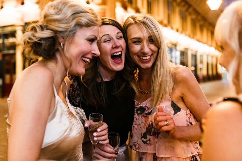 wedding guests laughing 